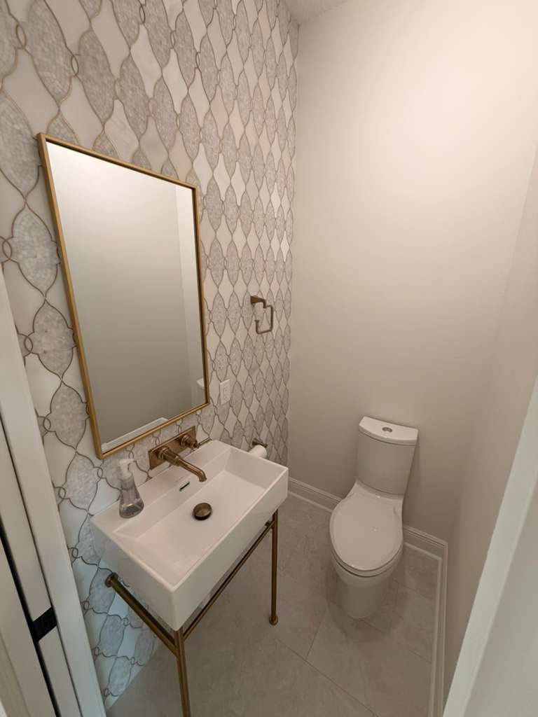 Designer Powder Room — Bathrooms by American Apex Construction