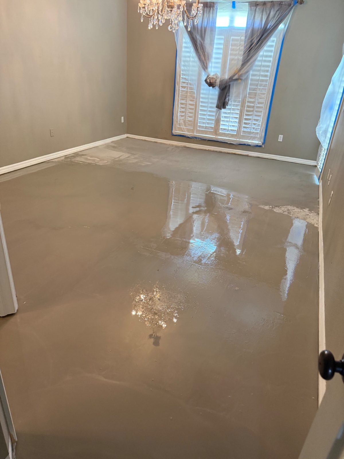 Self-leveling concrete floor preparation by American Apex Construction in Florida