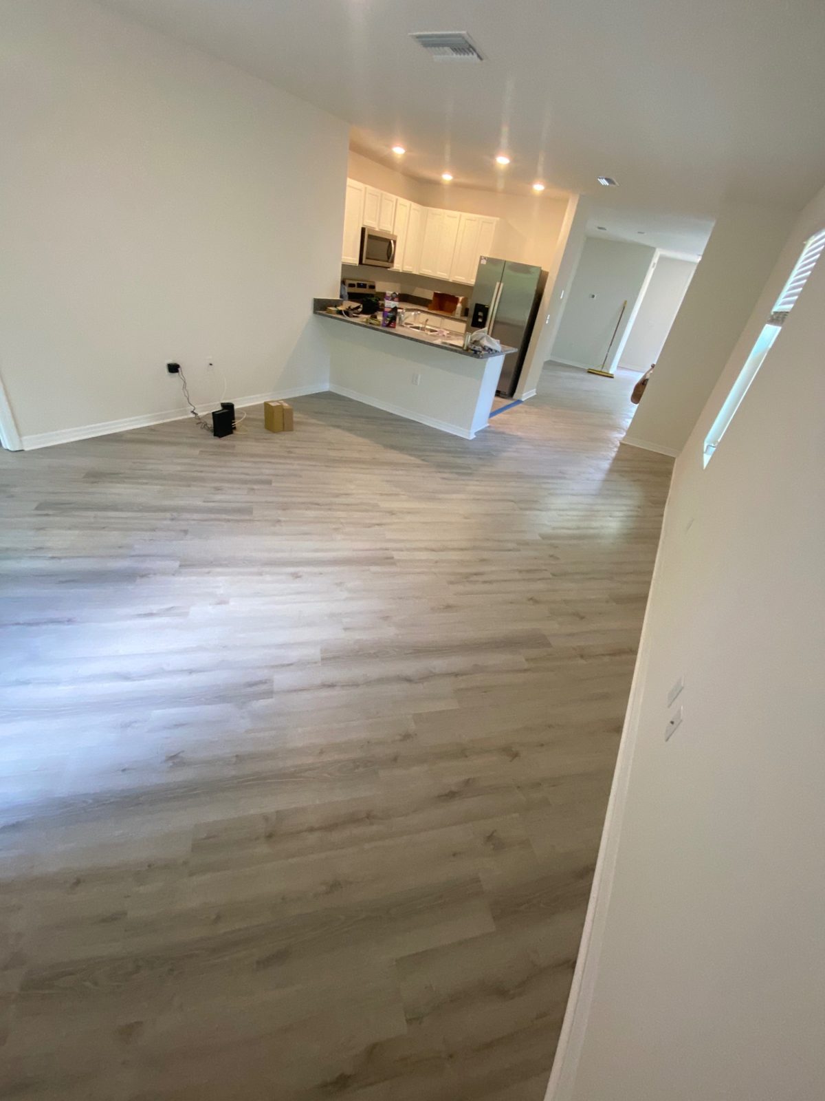 Modern Gray Vinyl Floor — luxury vinyl flooring by American Apex Construction