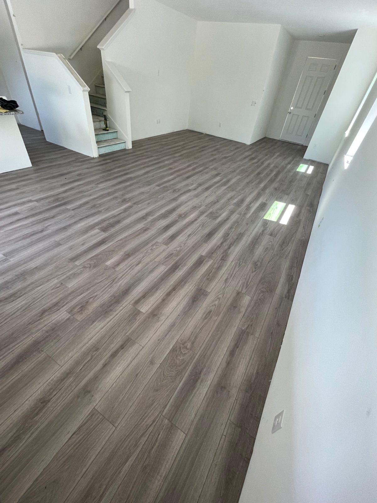 Gray-Oak LVP Living Area — Vinyl Flooring by American Apex Construction